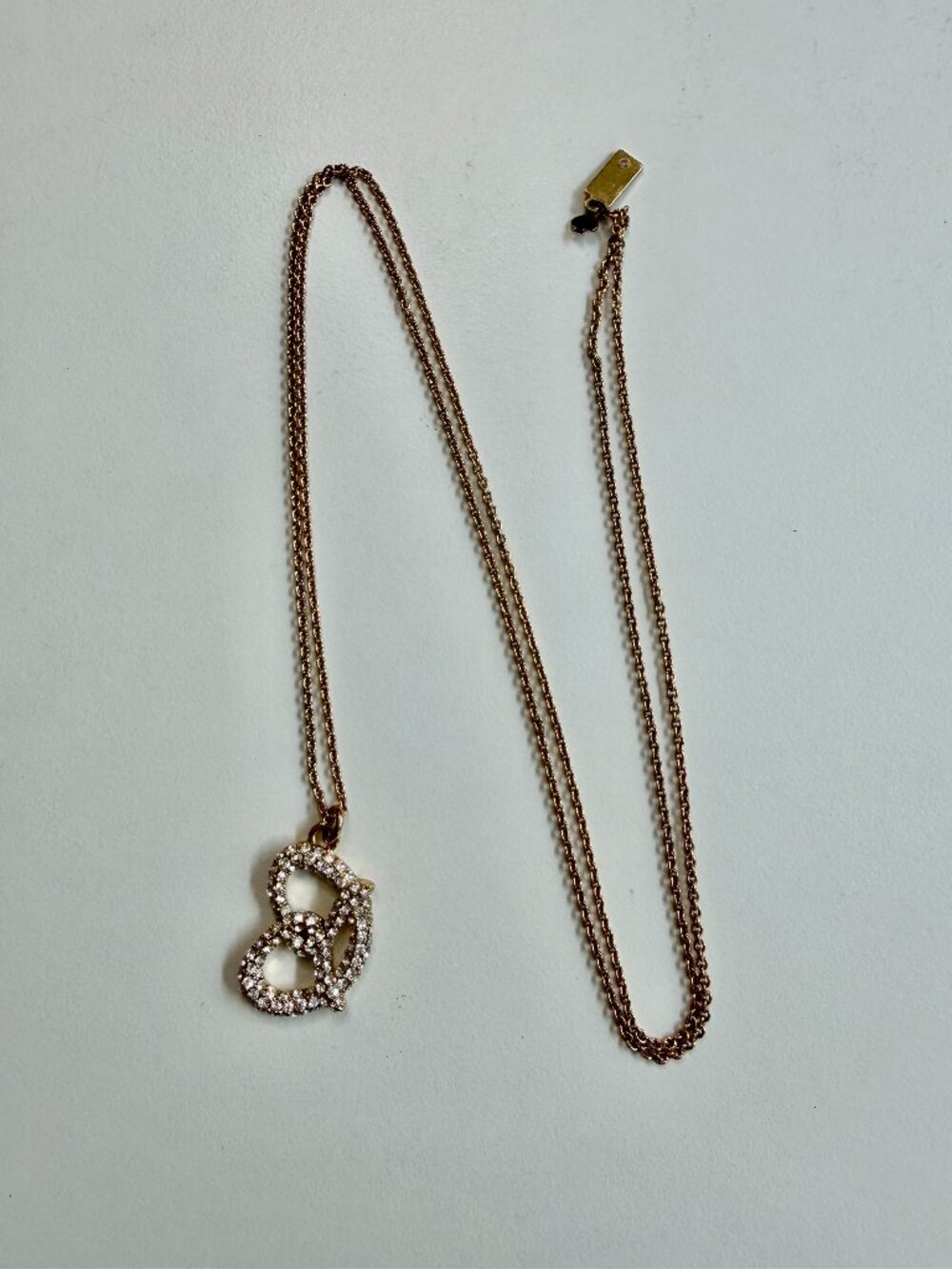kate spade New York pave rhinestone pretzel necklace